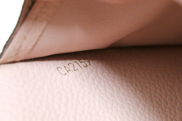 Louis Vuitton Pink Monogram Empreinte Leather Sarah Wallet