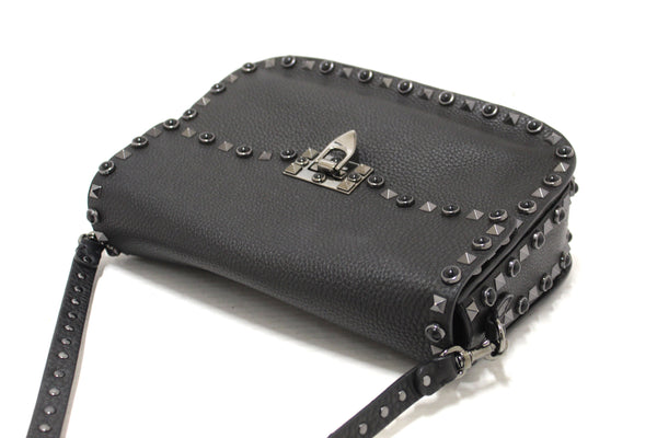 Valentino Garavani Black Grained Calfskin Rolling Rockstud Flap Crossbody Bag