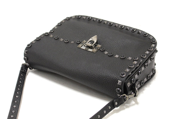 Valentino Garavani Black Grained Calfskin Rolling Rockstud Flap Crossbody Bag
