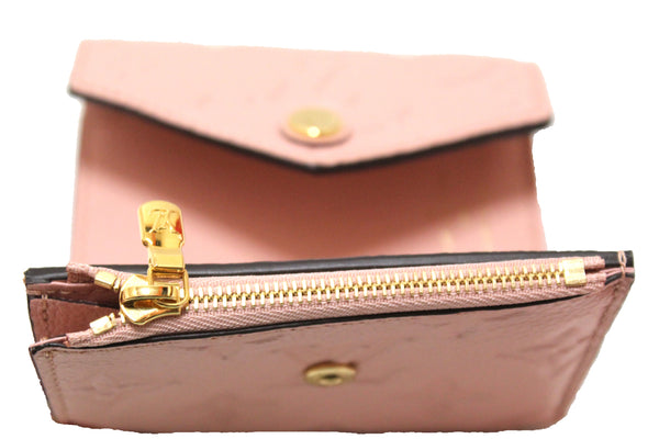 Authentic Louis Vuitton Pink Monogram Empreinte Leather Zoe Wallet