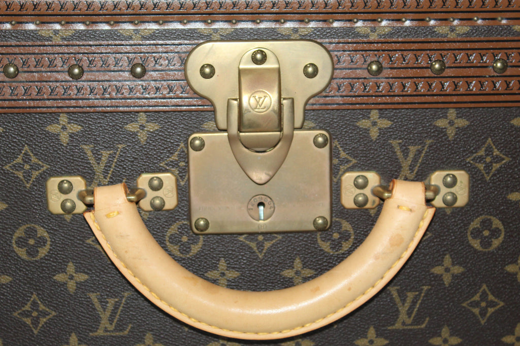 LOT:164  LOUIS VUITTON - a Monogram Alzer 75 hard suitcase.