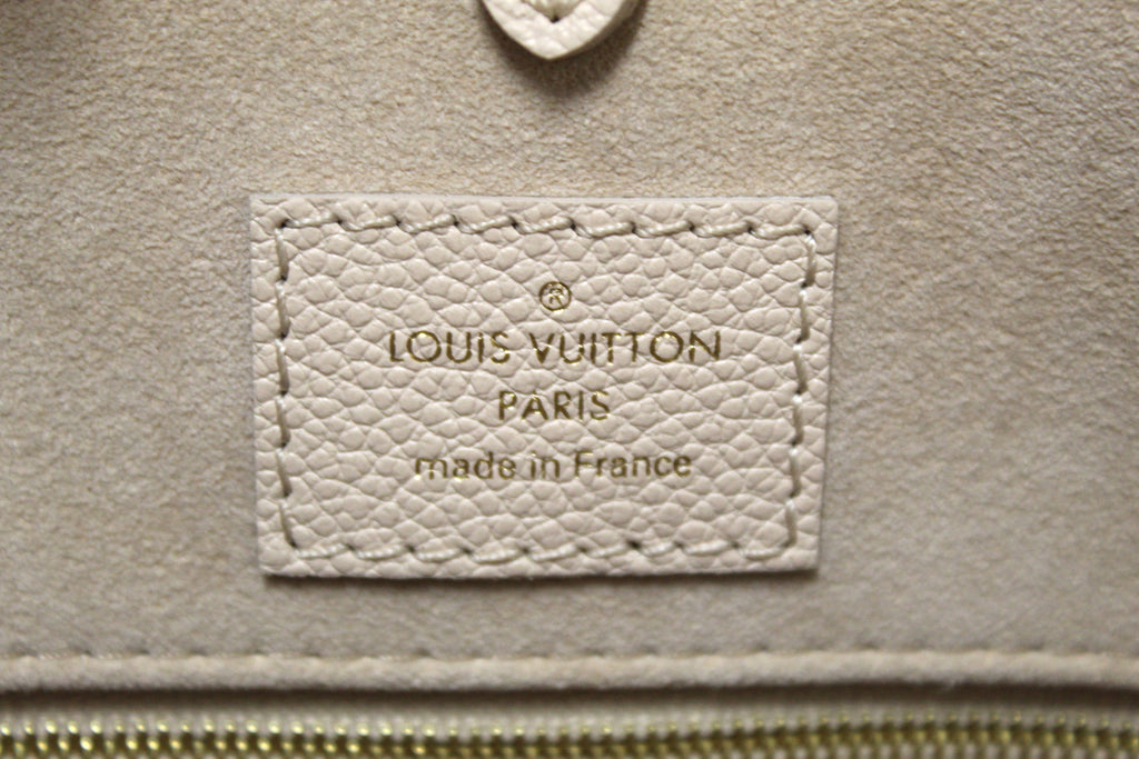 Authentic NEW Louis Vuitton Rose Beige Monogram Empreinte Cowhide Leather  OnTheGo MM Bag – Italy Station