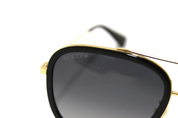Gucci 黑色和金色太陽鏡 GG0062S